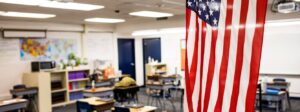 Empty classroom with American flag hanging