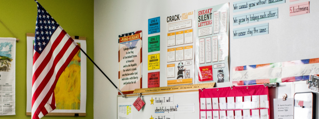 Photo of posters and an American flag in a classroom